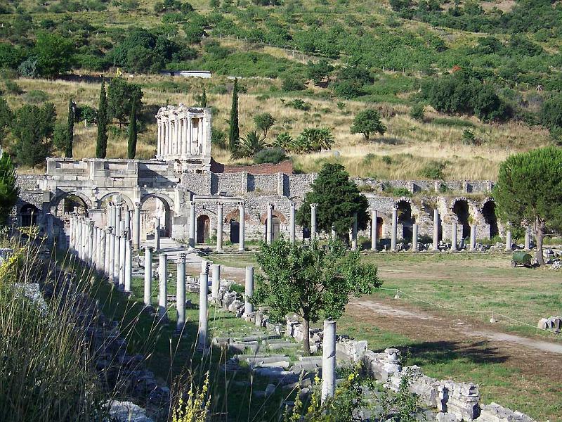 Ancient pillars, stone wall and garden at Ephesus